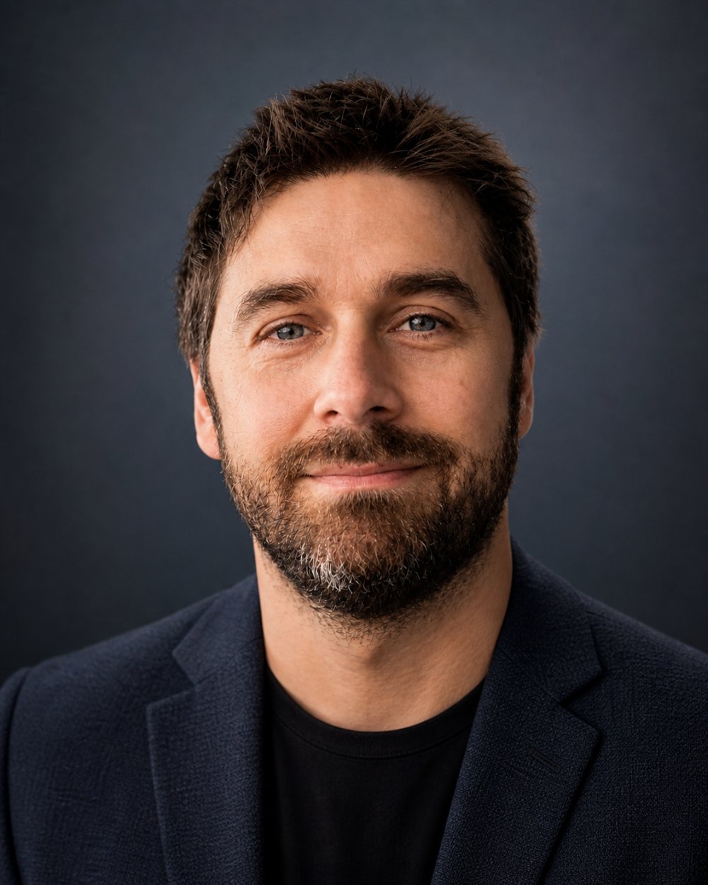 Patrick Sullivan, co-founder of The 3 Languages Group, in a navy jacket against a dark background